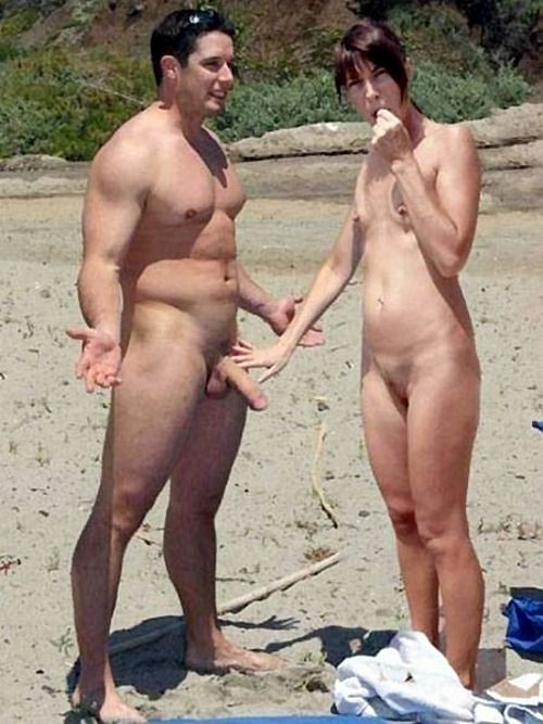romantic couple on beach naked