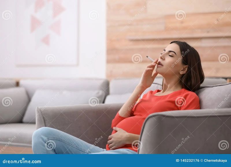 woman smoking cigarette indoors