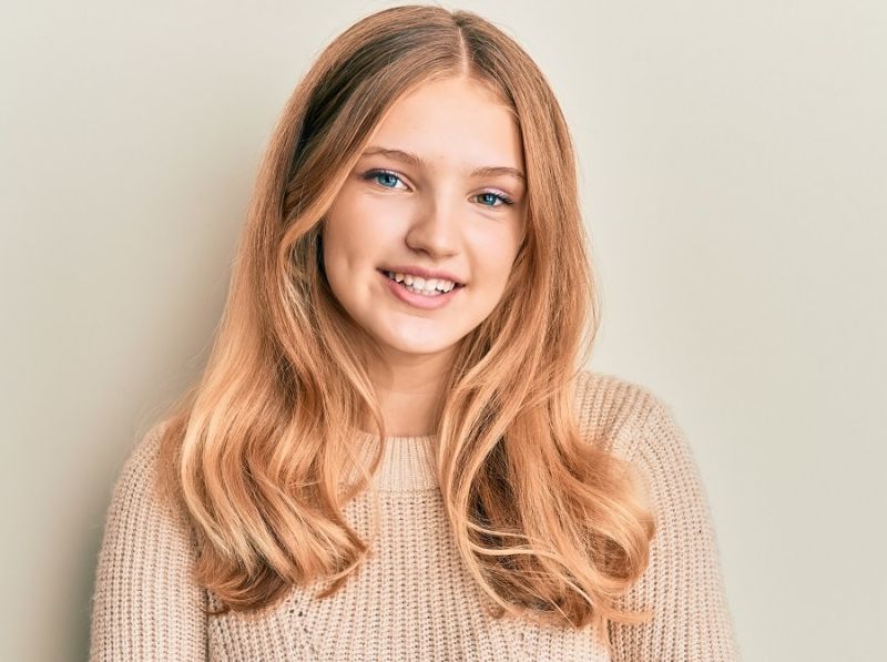 girl with strawberry blonde hair and blue eyes